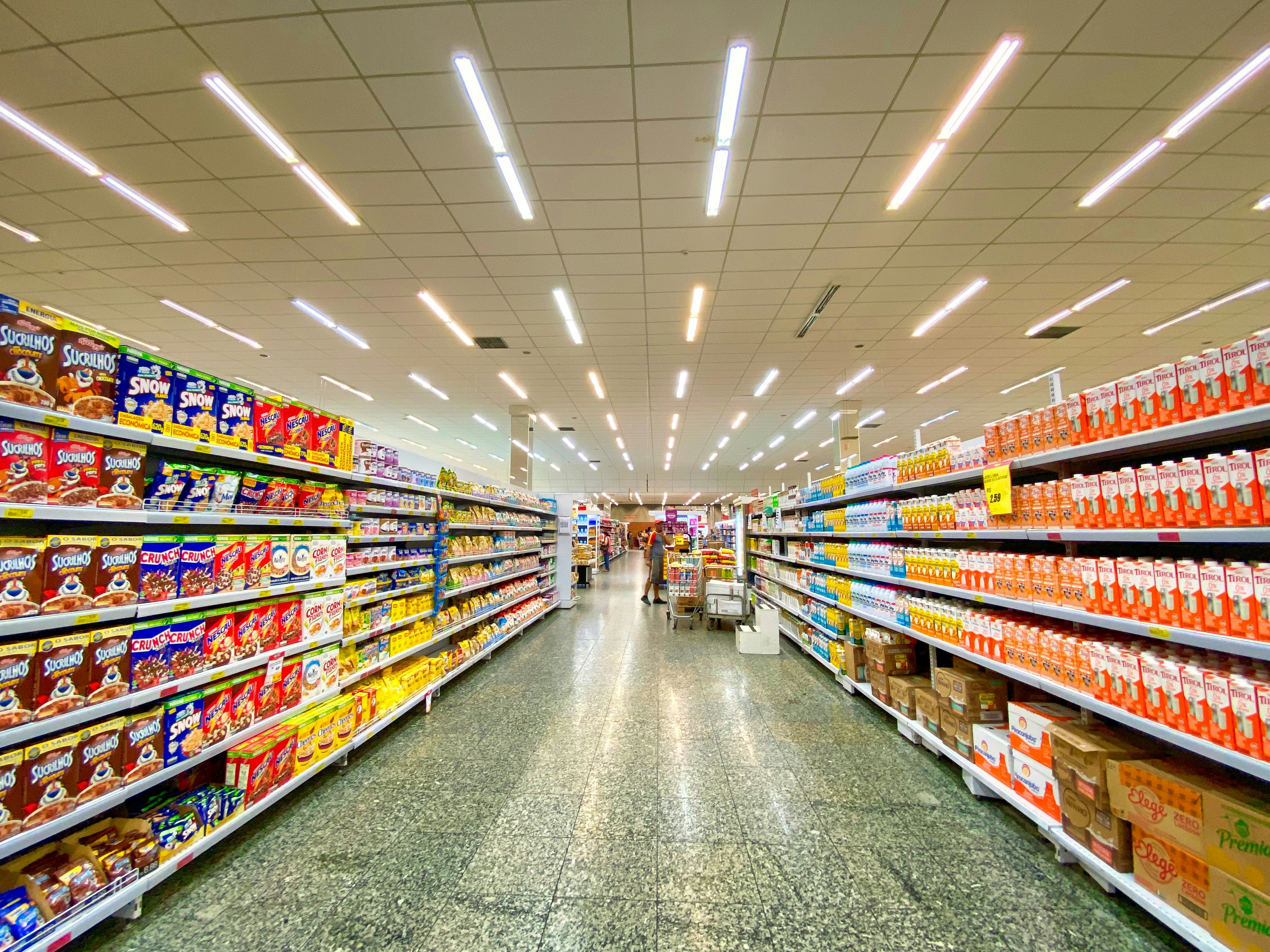 Supermarket aisle with cereal and grocery shelves